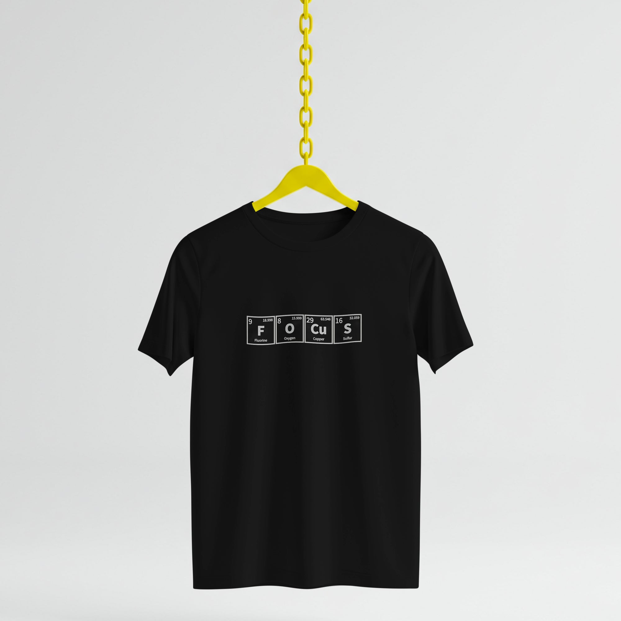 Black t-shirt with 'FOCUS' text on a yellow hanger against a light gray background