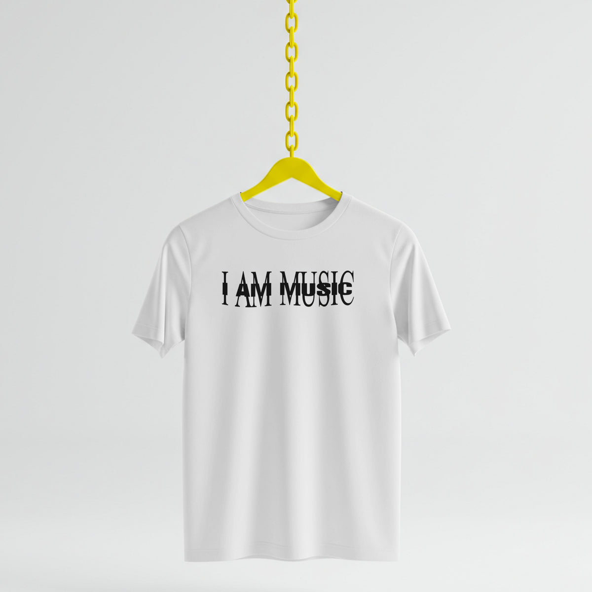 White t-shirt with 'I AM MUSIC' text on a yellow hanger against a white background