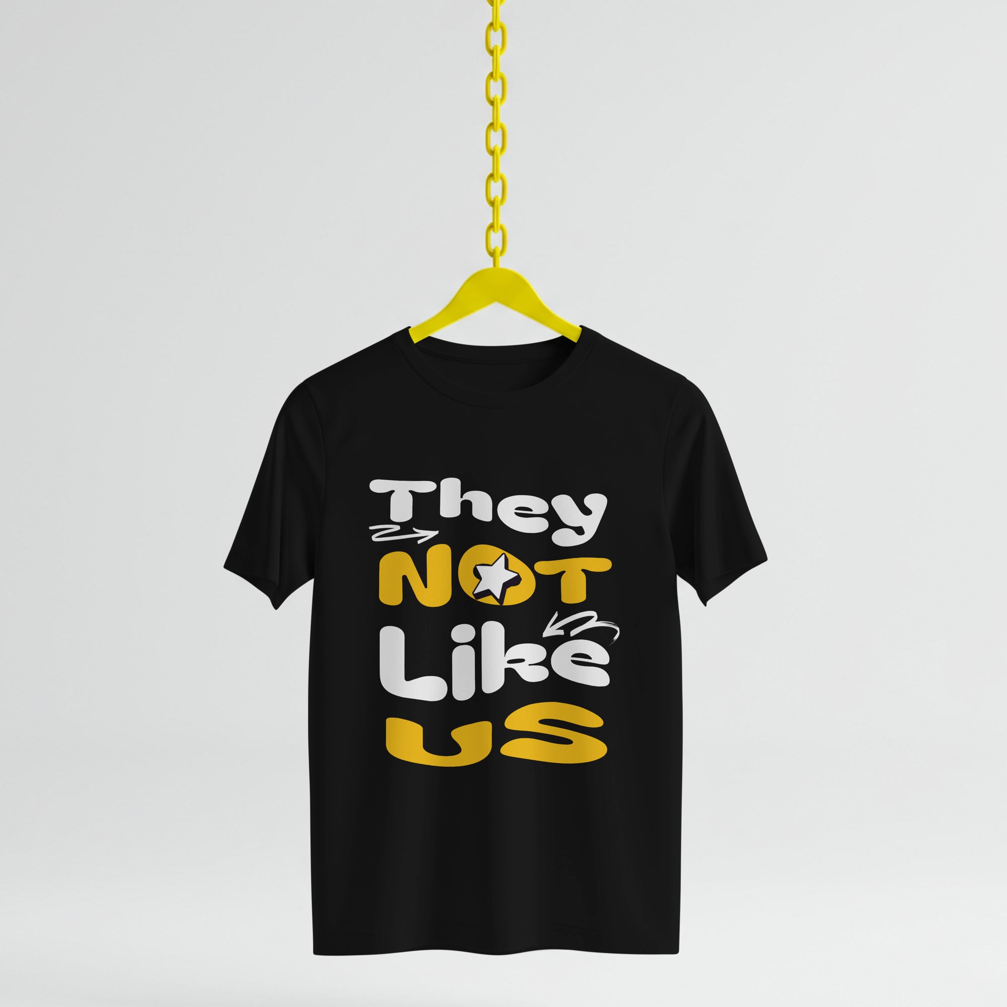 Black t-shirt with colorful text on a yellow hanger against a light gray background
